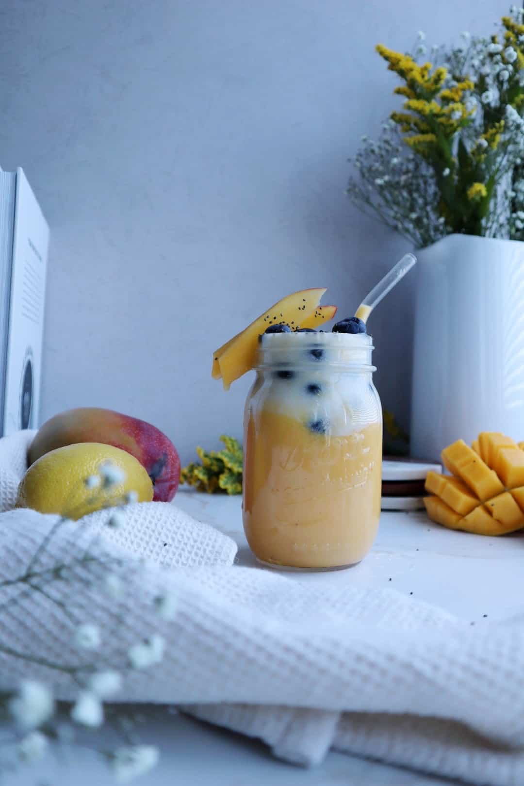golden mango coconut smoothie with blueberries