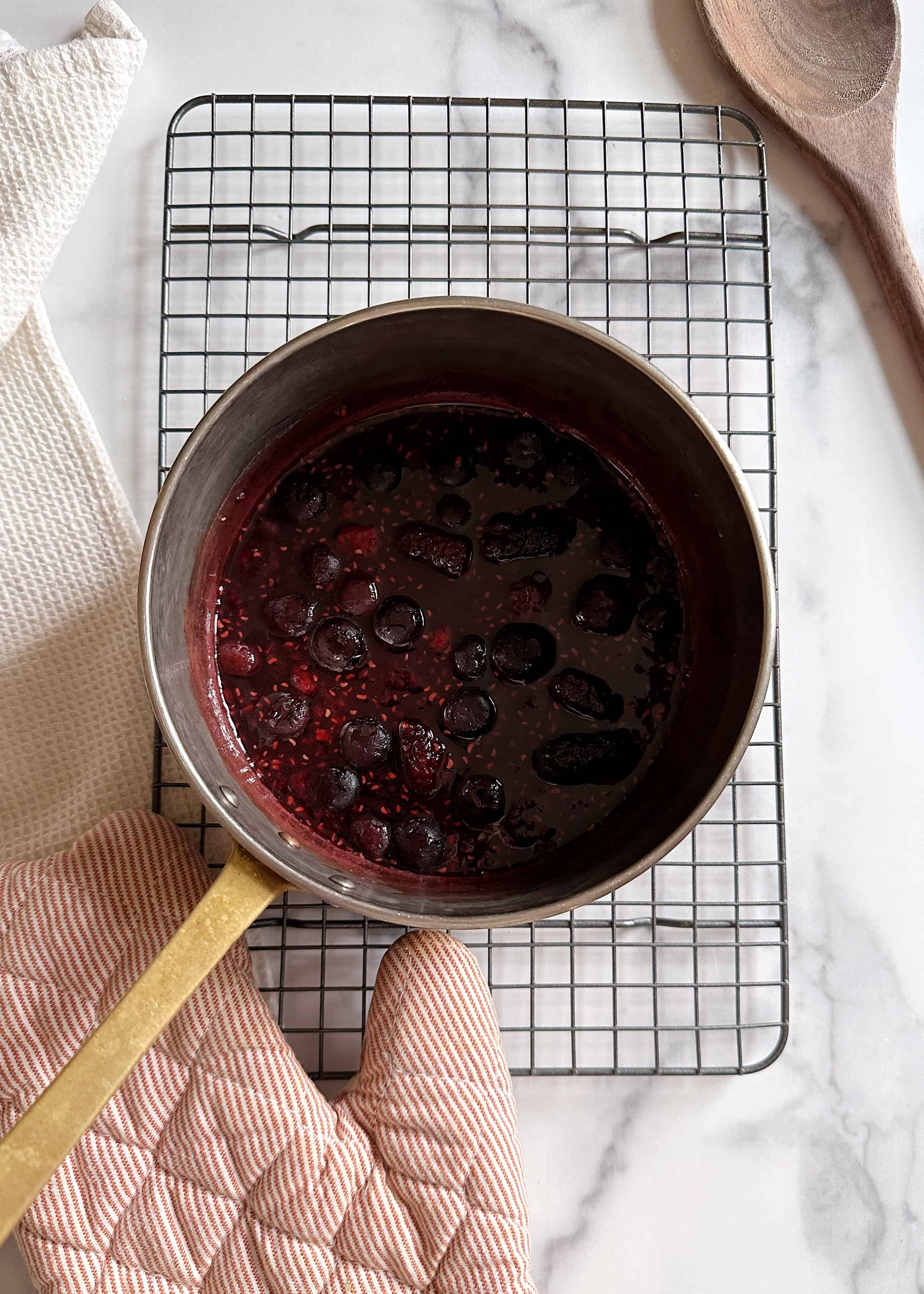 berry simple syrup in copper pan