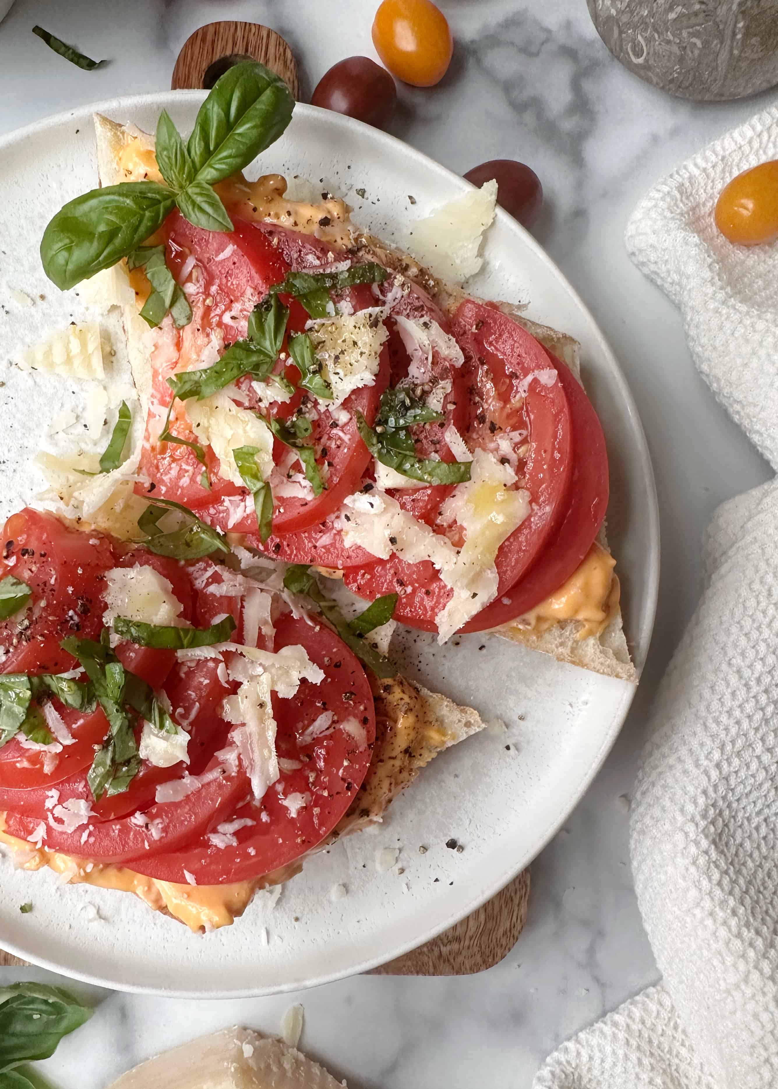 tomato toast with calabrian chili spread and parmesan