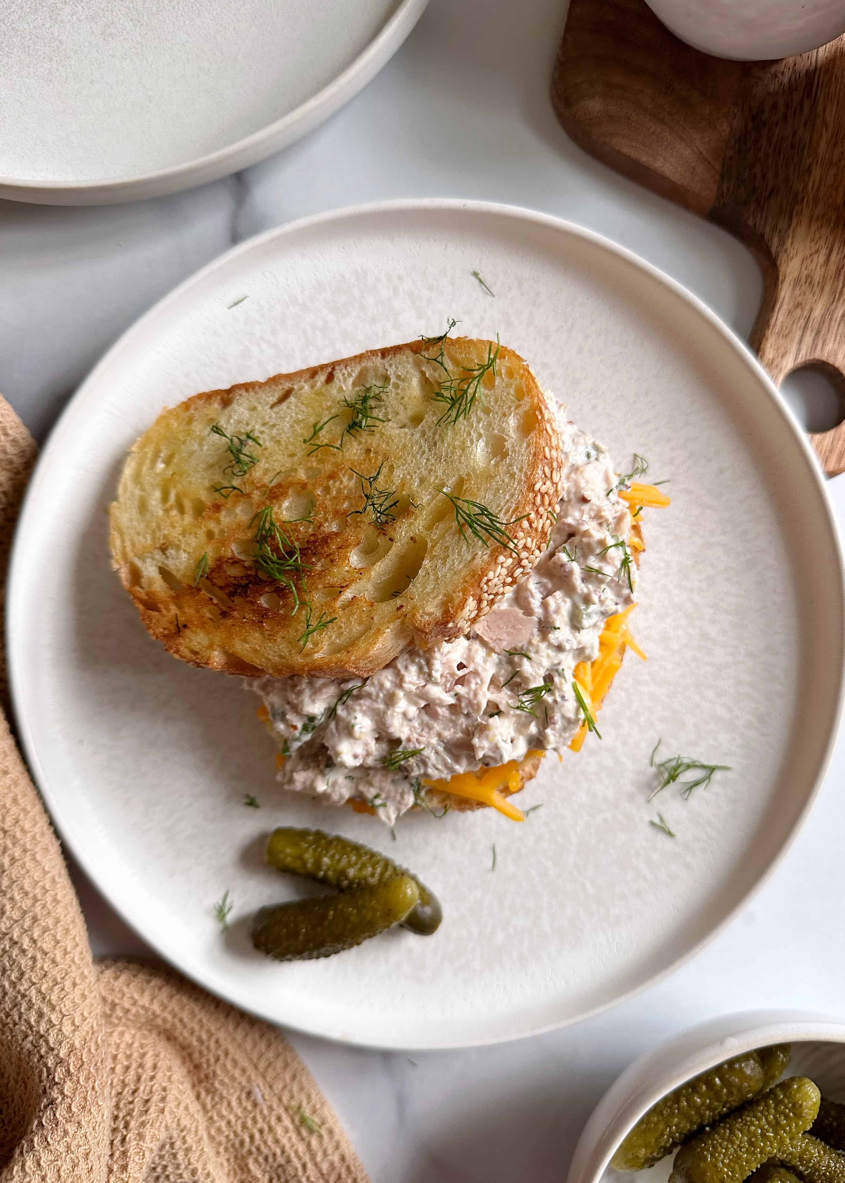 Tuna Melt with Dill Pickle Tuna Salad on White Plate