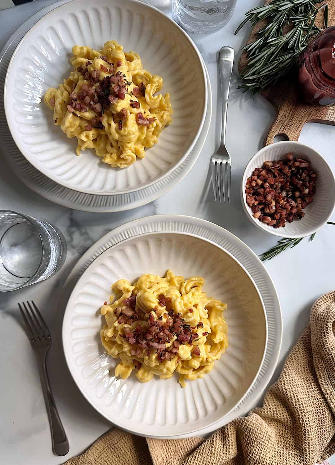 two bowls of butternut squash alfredo with rosemary pancetta 