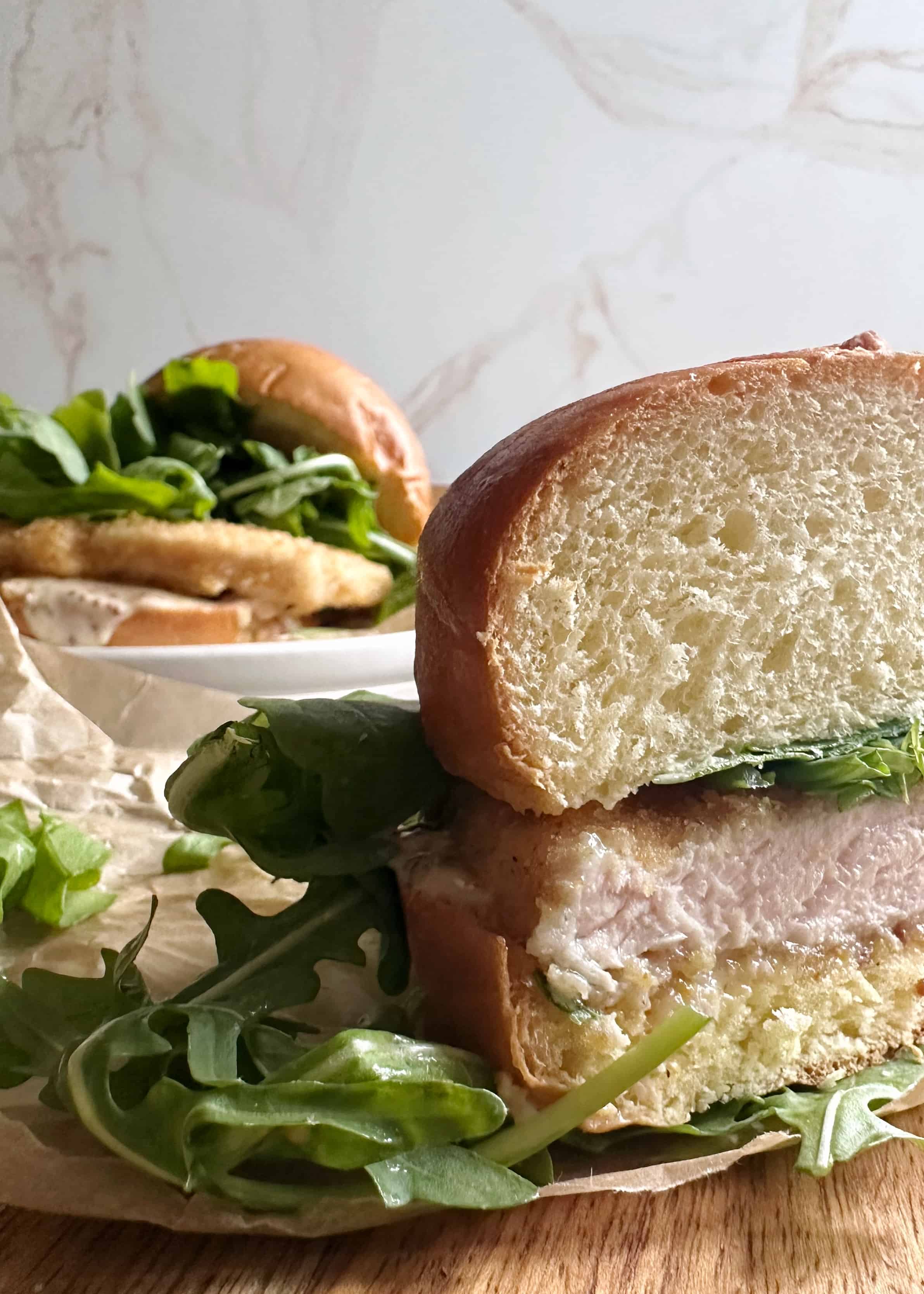 pork schnitzel sandwich cut in half