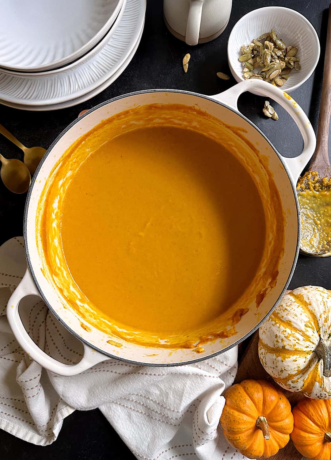 curry carrot pumpkin soup in white dutch oven