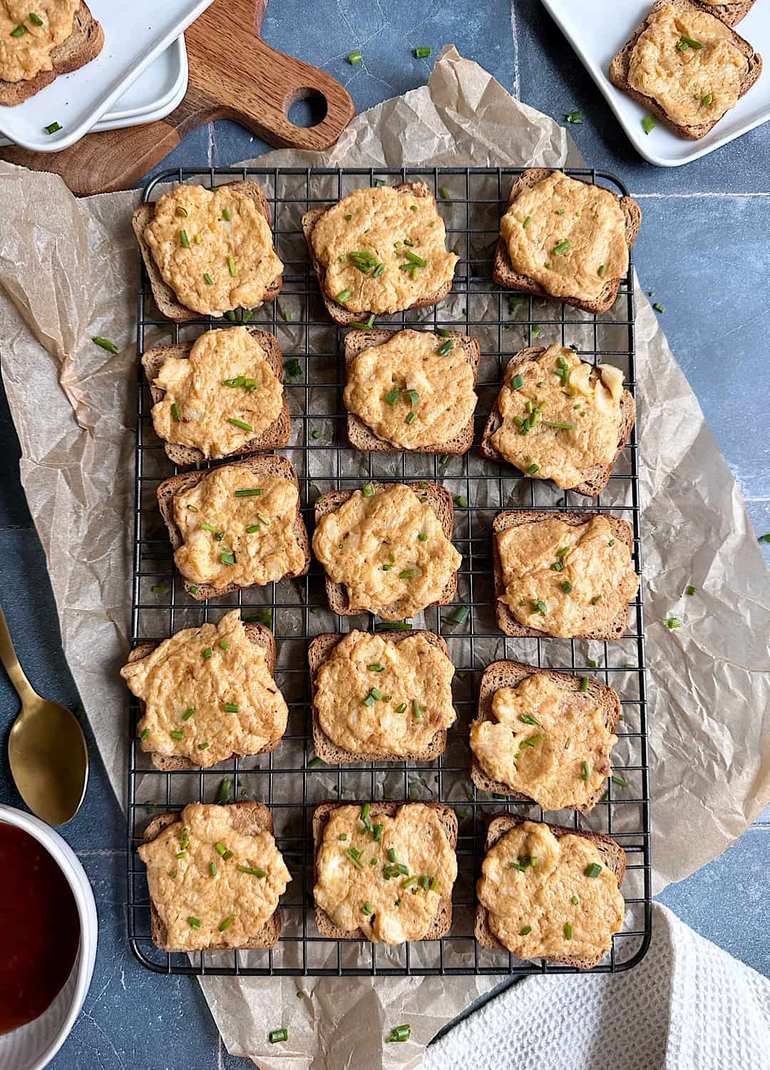 cheesy crab toasts on cooling rack