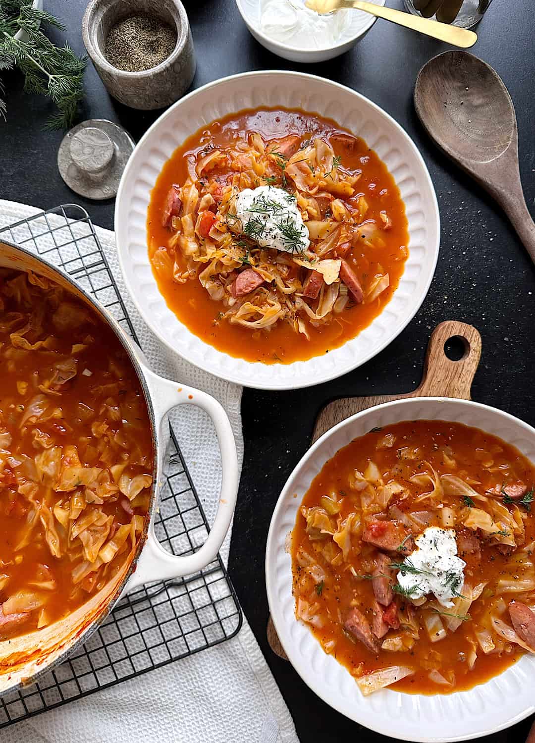 two bowls of tomato cabbage kielbasa soup