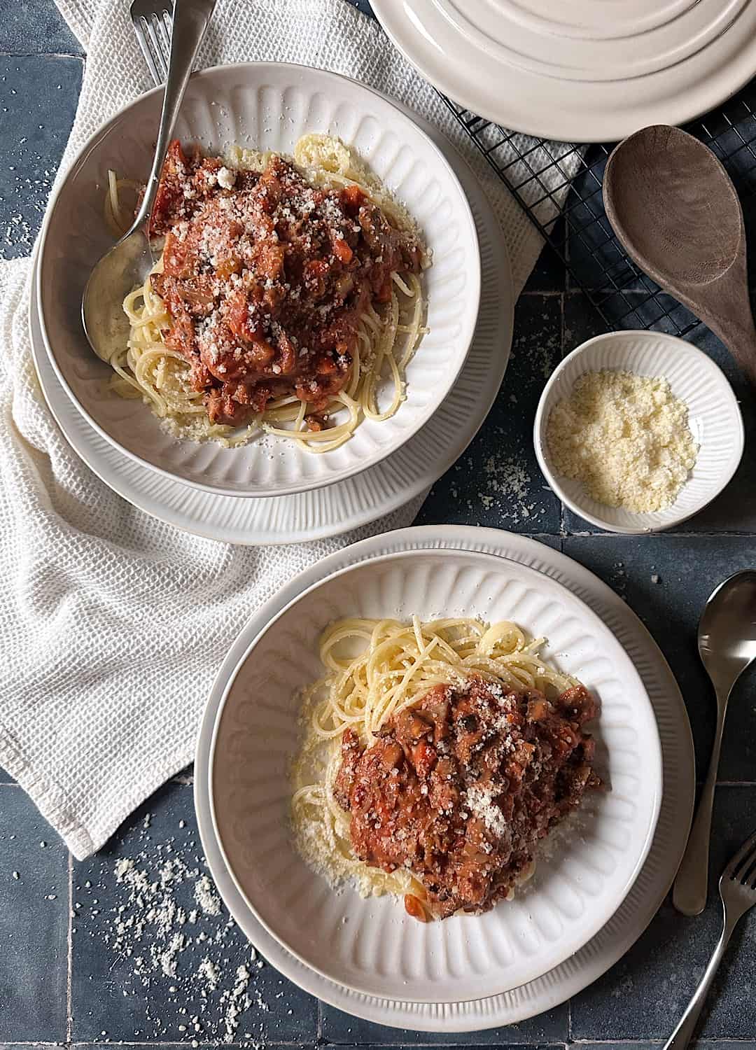 two bowls of hearty mushroom bolognese and spaghetti