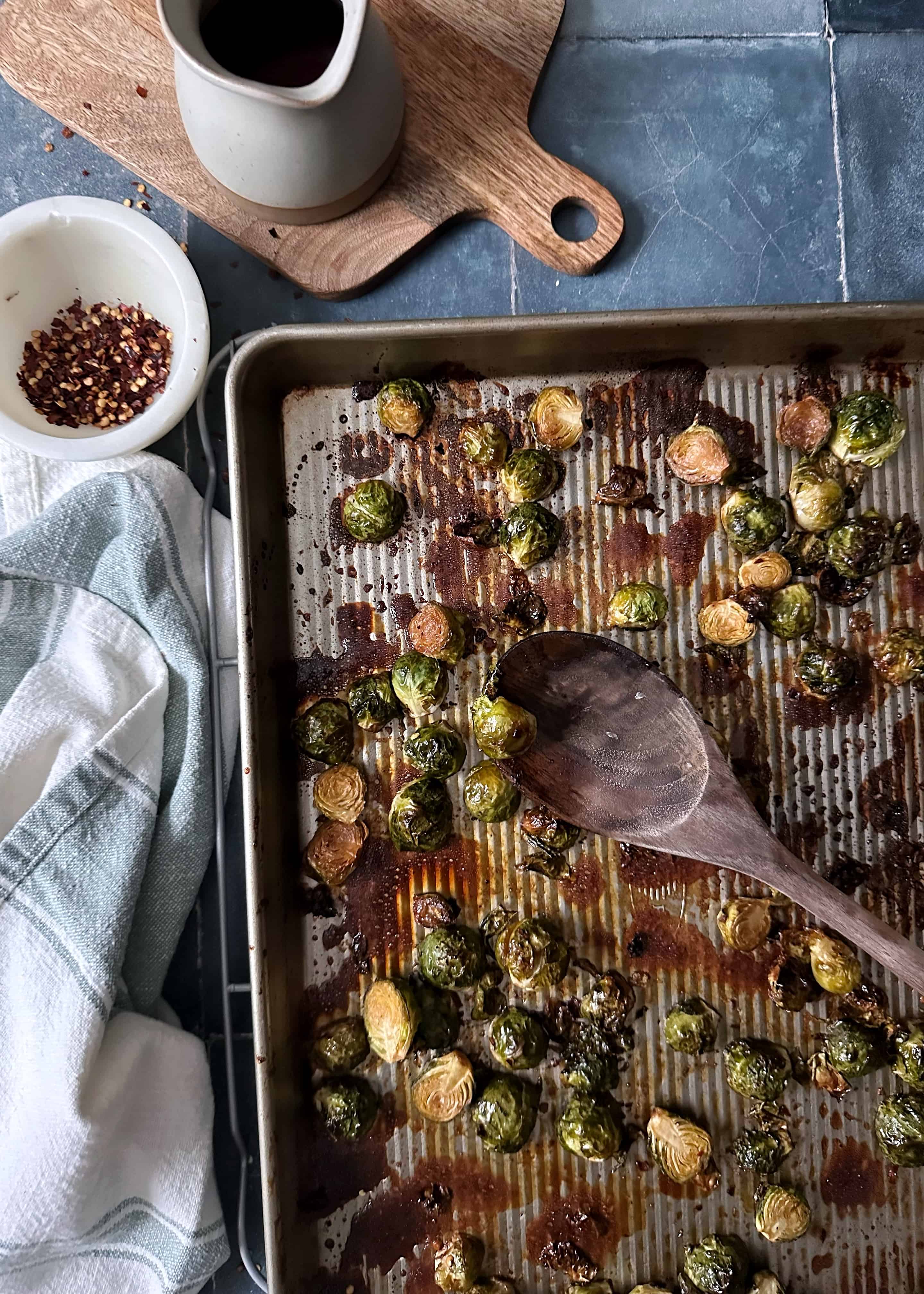 chili maple balsamic brussels sprouts on baking tray