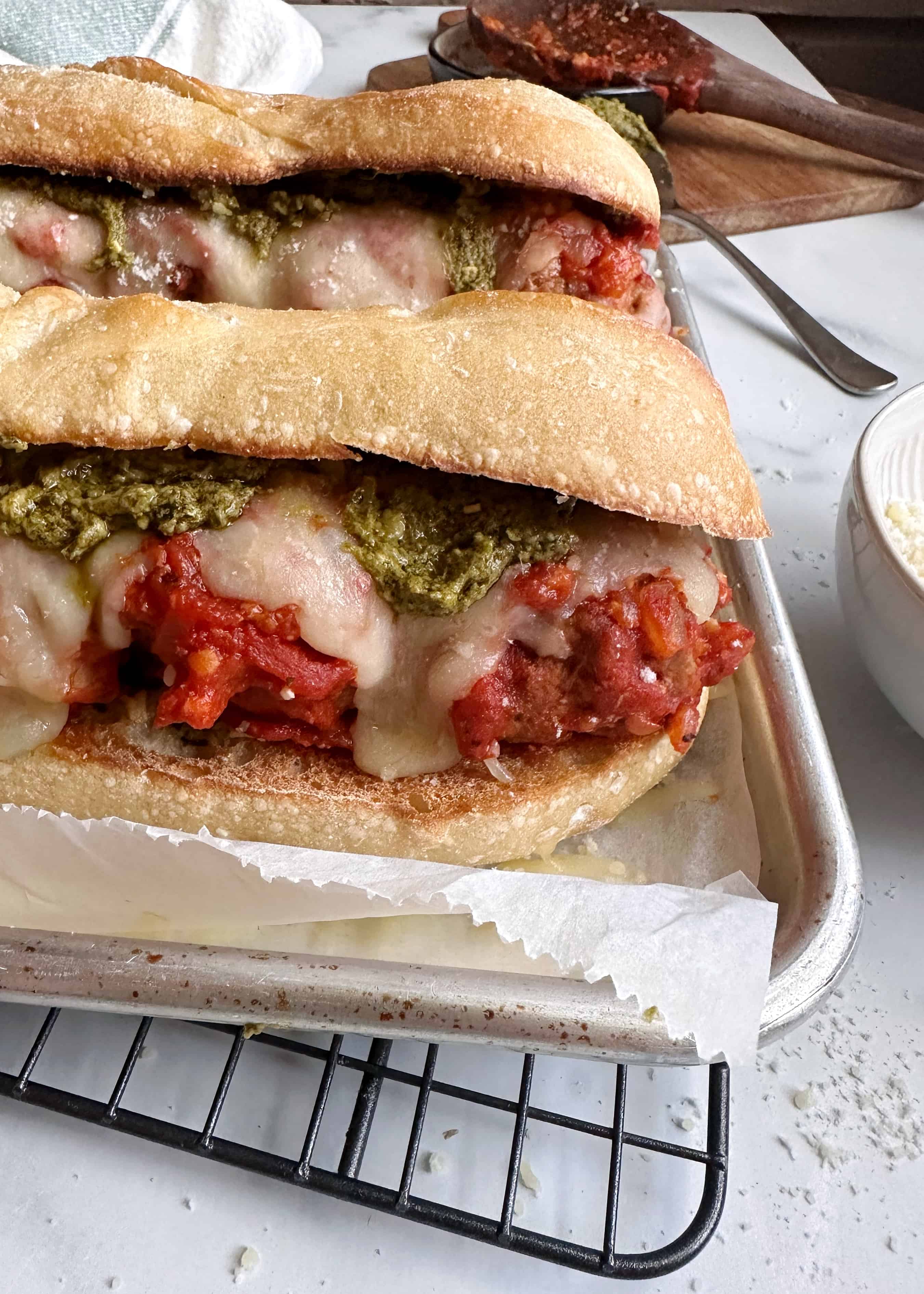 garlic bread meatball sub with cheese and pesto