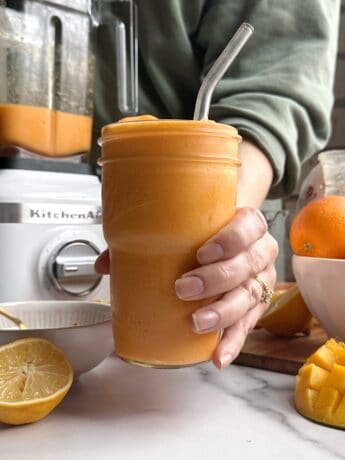 mango orange carrot smoothie in a glass
