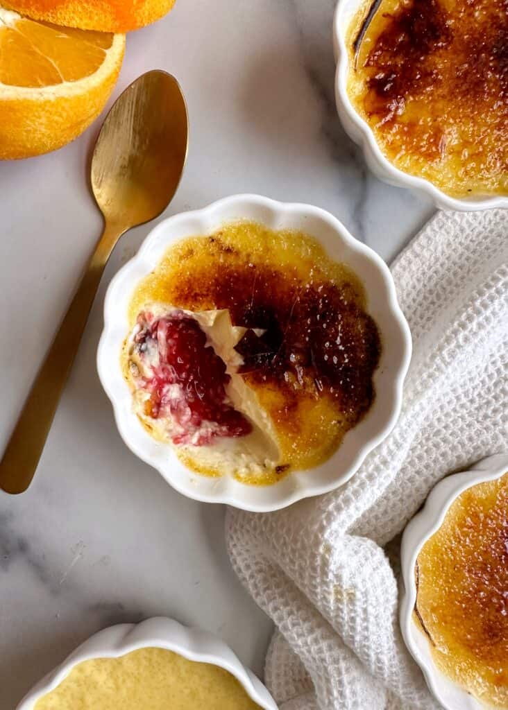 Orange Vanilla Creme Brulee with Raspberry Coulis