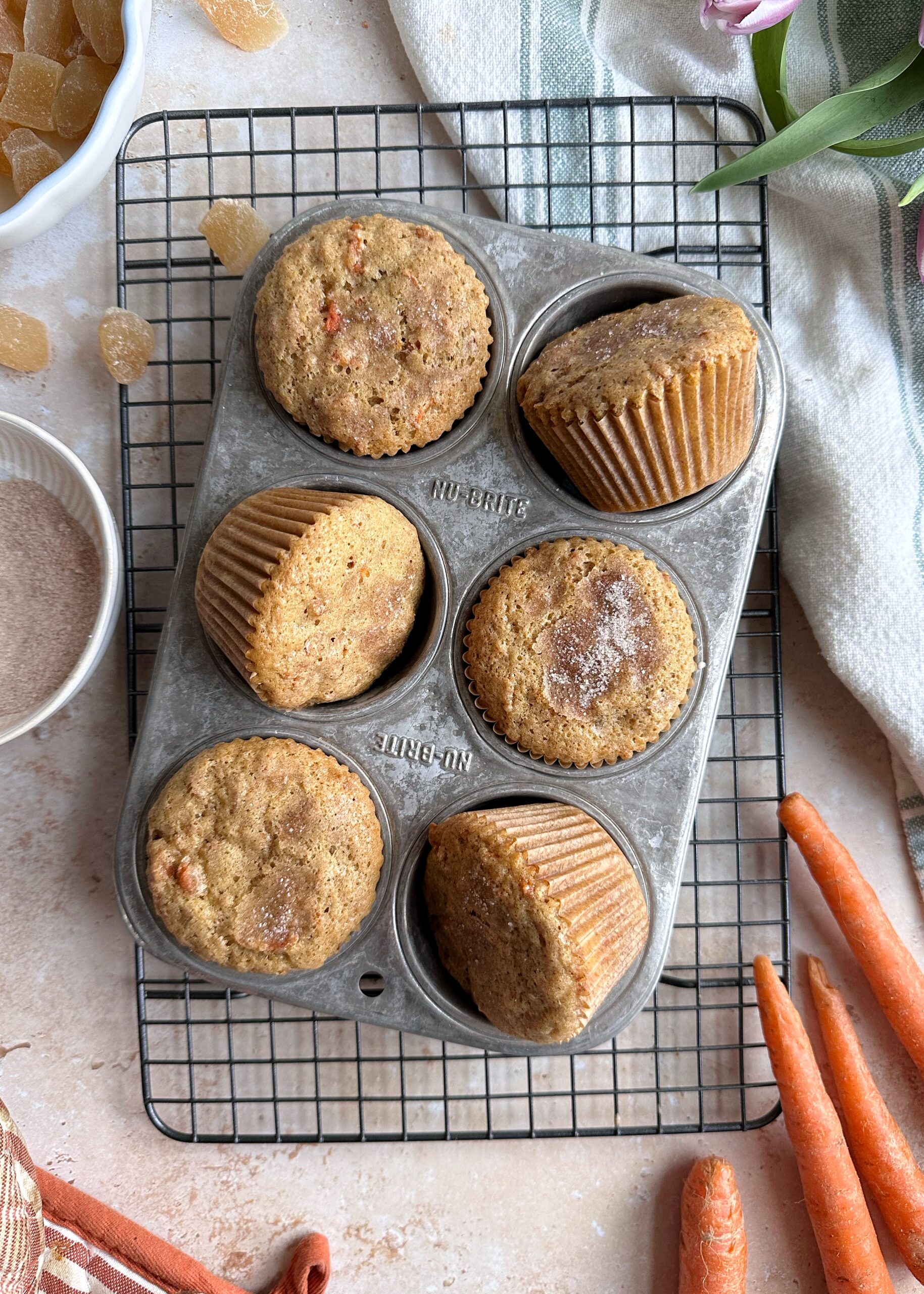 baked carrot ginger muffins in tin