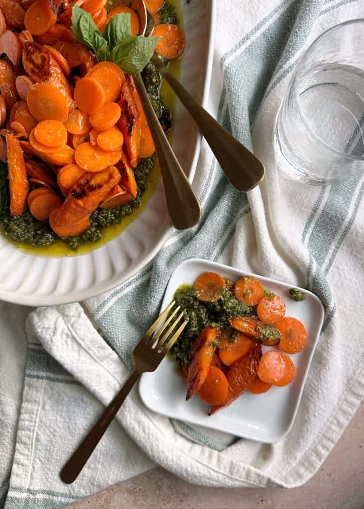 serving of raw and roasted carrot salad with carrot top pesto
