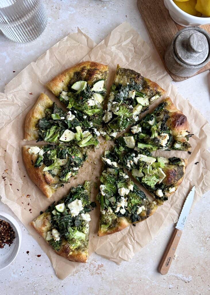 entire vegetable pesto pizza cut into slices