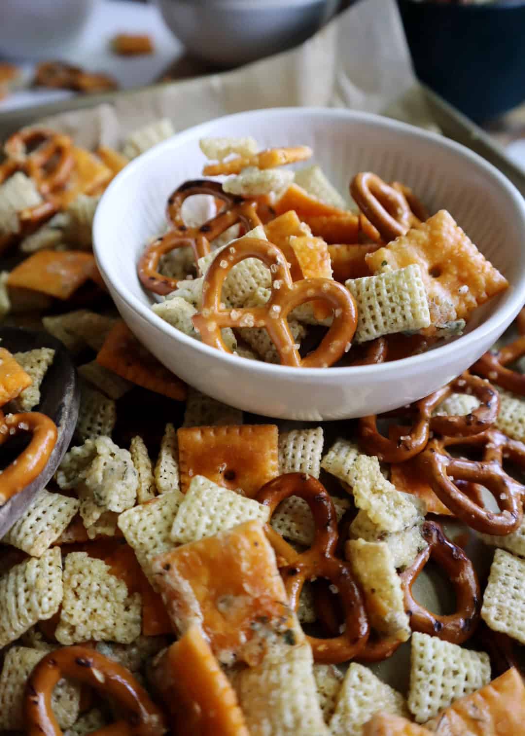 close up of ranch snack mix in white bowl