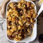 sausage and cranberry stuffing with silver serving spoon