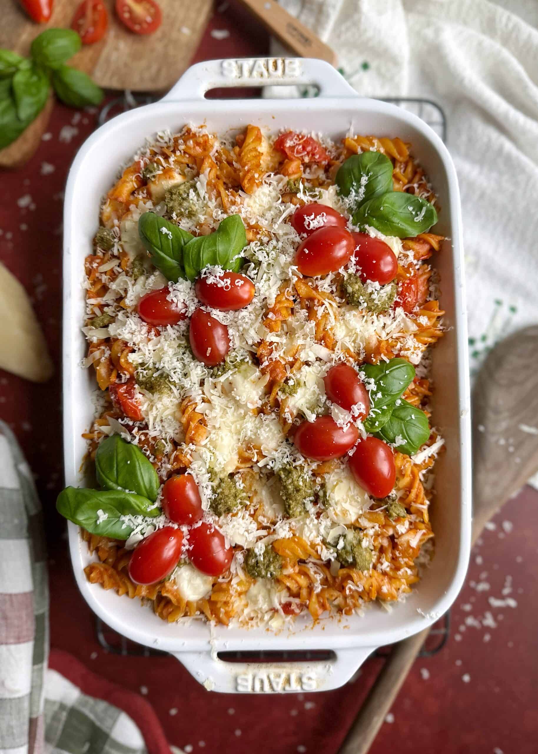 baked christmas pasta with cherry tomatoes and fresh parmesan cheese