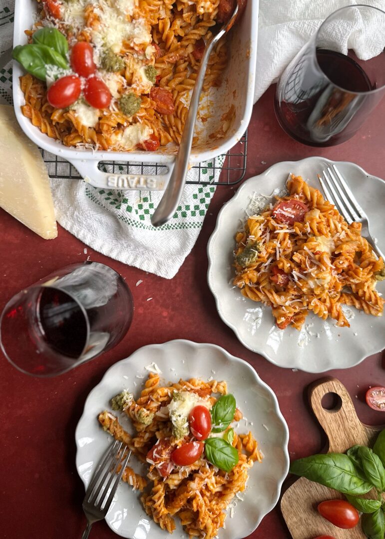 baked christmas pasta with two plates of servings