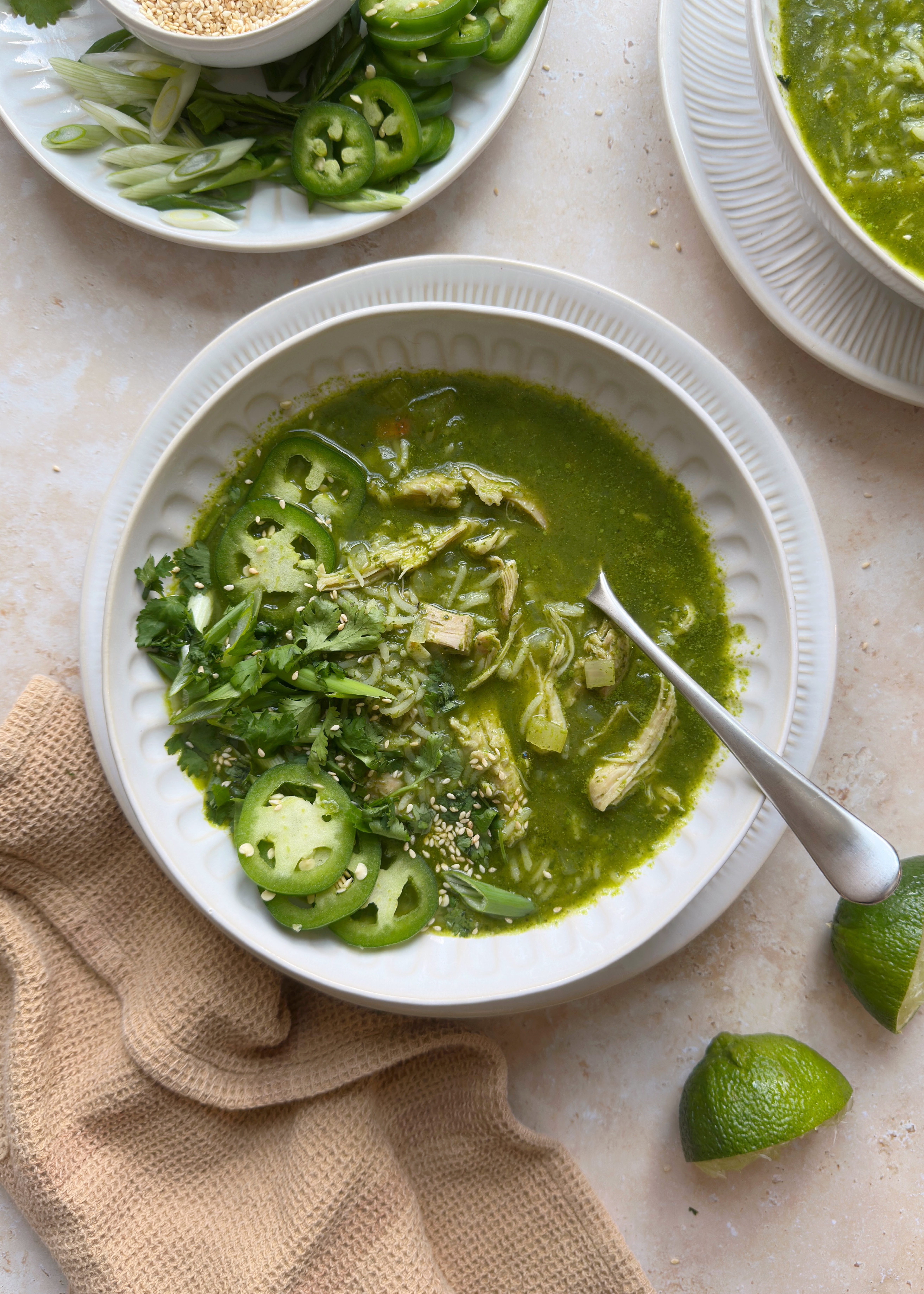 green ginger chicken and rice soup in white bowl