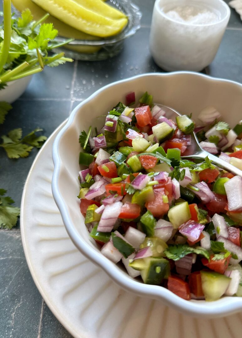 pickle de gallo in white bowl with silver spoon