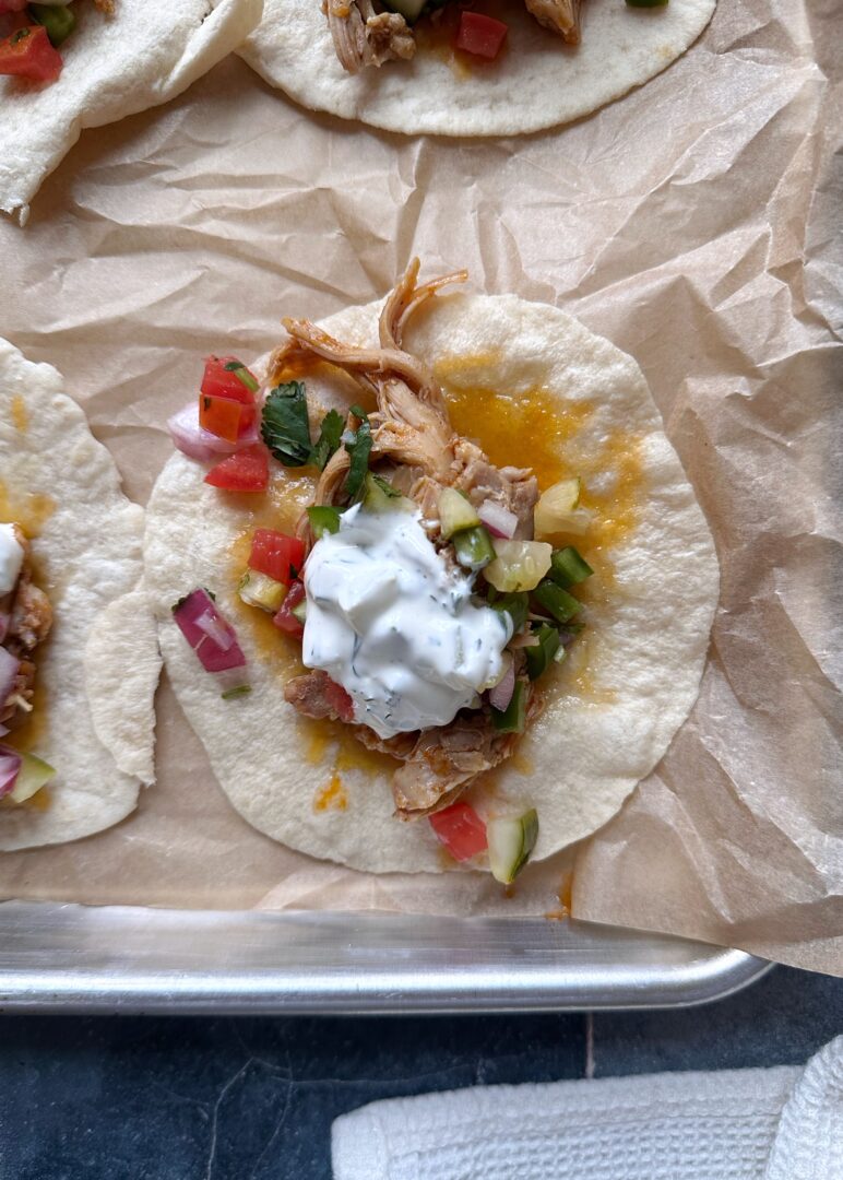 pulled chicken taco with pickle de gallo and pickle ranch