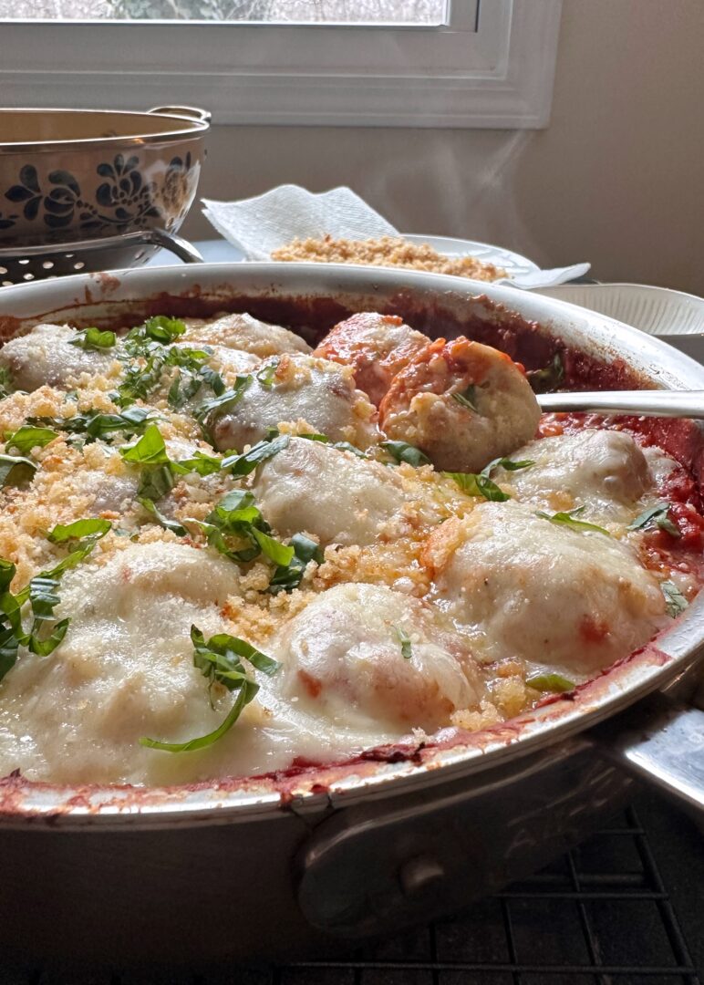 baked chicken parmesan meatballs in silver pan