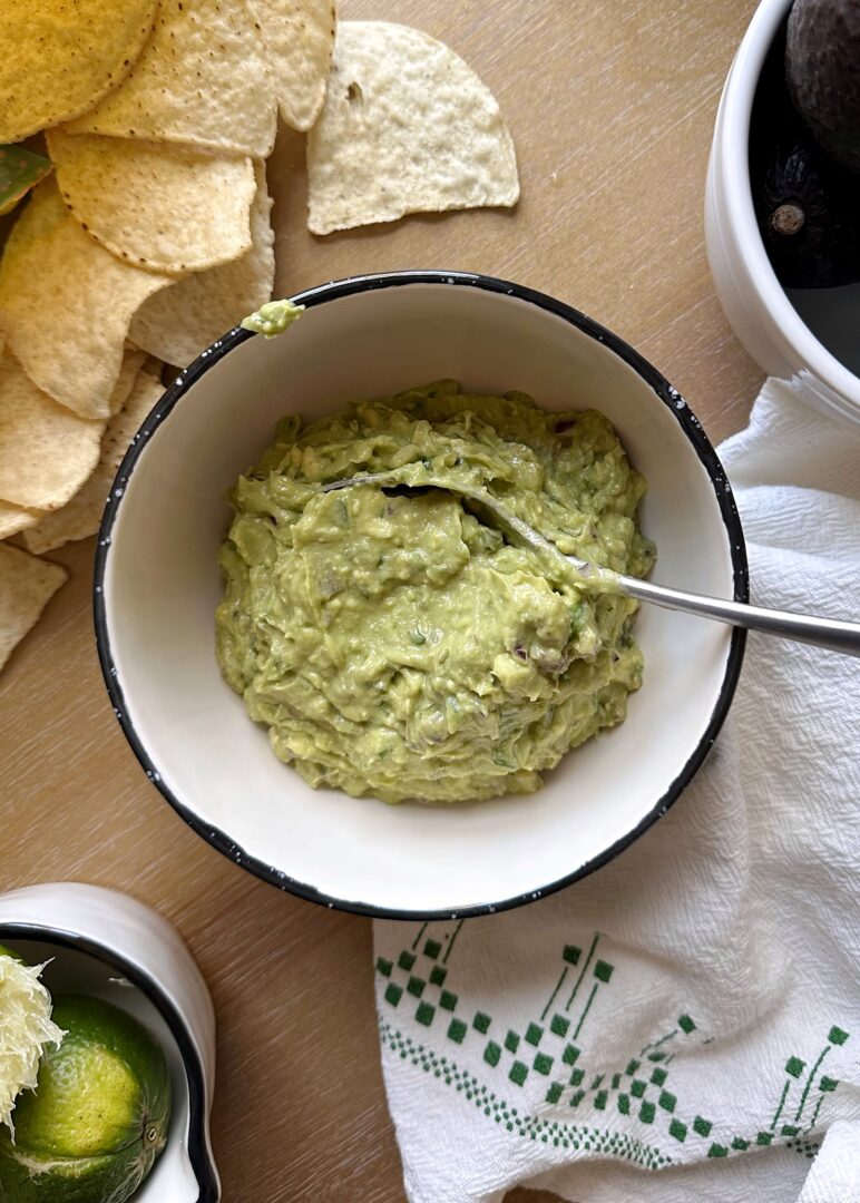 bowl of simple guacamole with chips