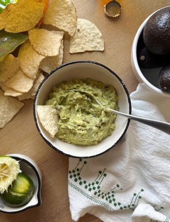 bowl of super simple guacamole with chips