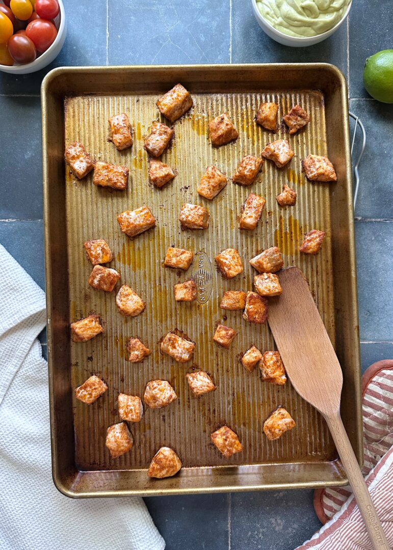baked cubed salmon on tray