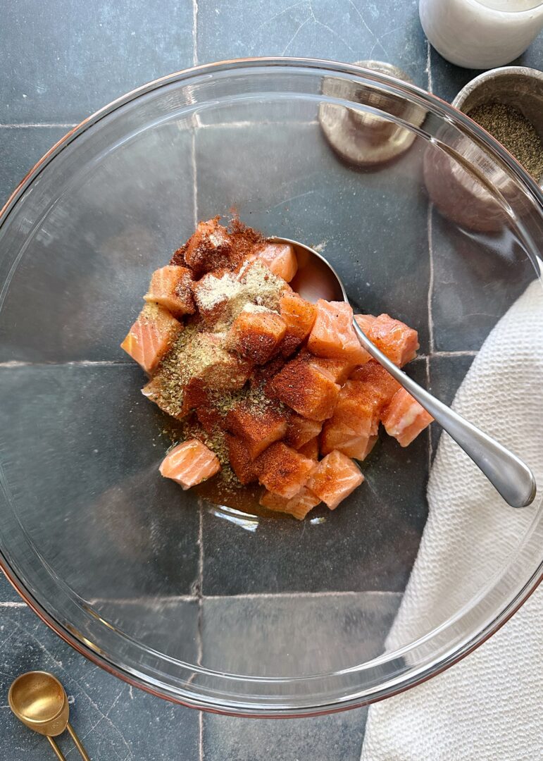 cubed salmon coated in spices