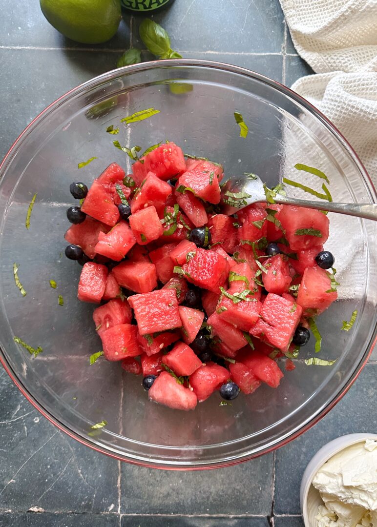 cubed watermelon and blueberries in a mixing bowl