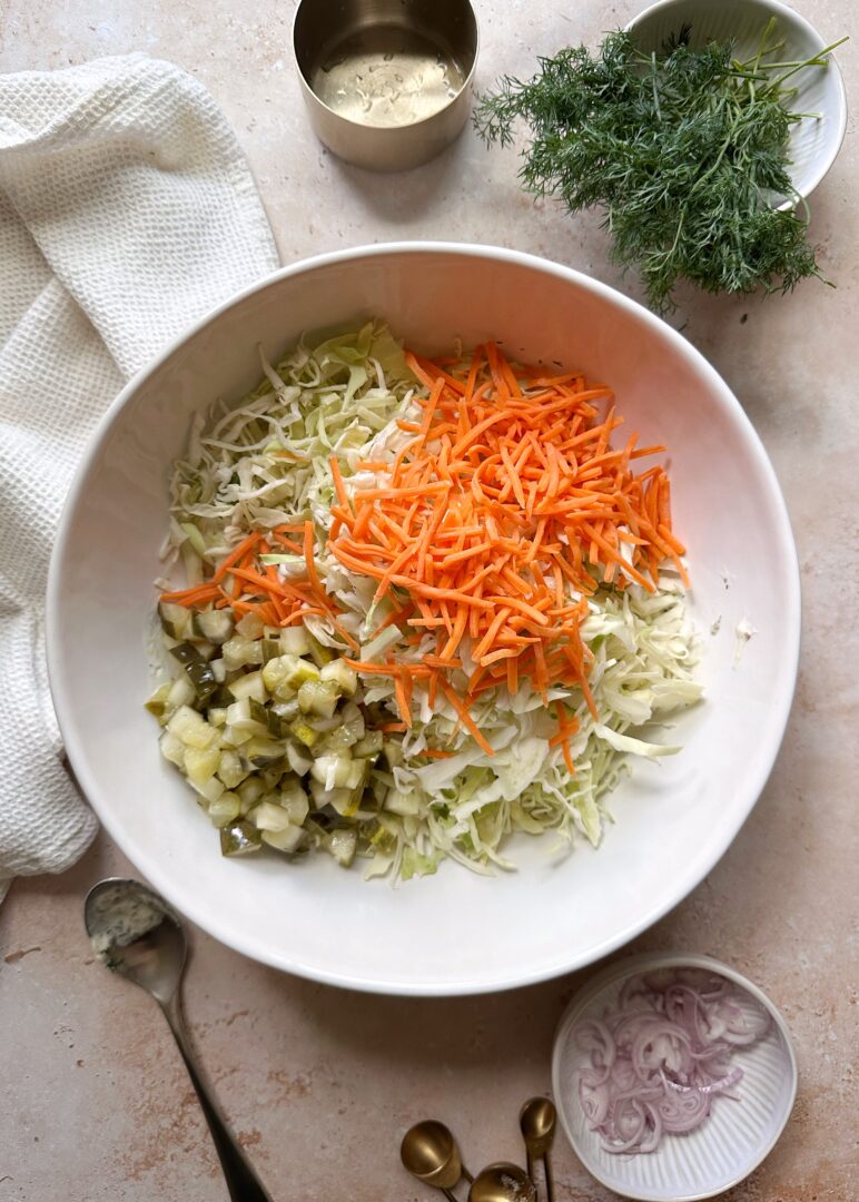 dill pickle coleslaw ingredients in mixing bowl