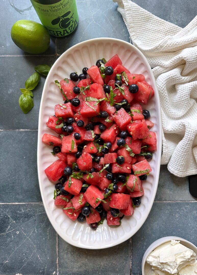 dressed watermelon blueberry salad on serving plate