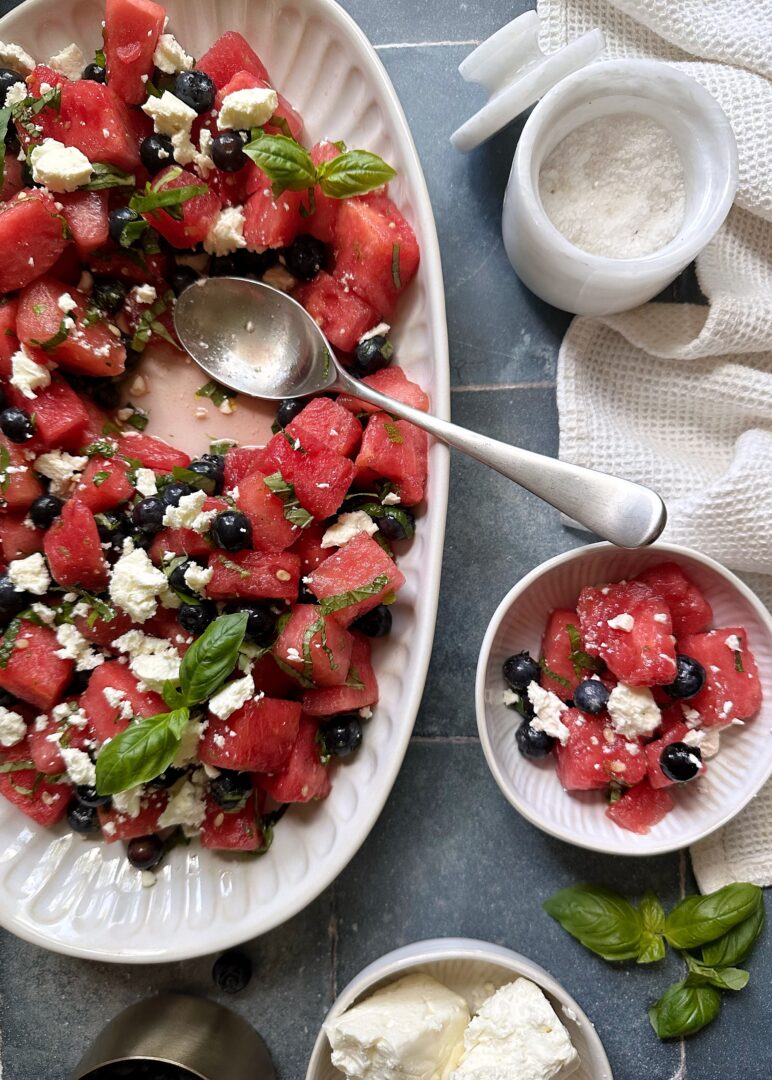 watermelon salad with blueberries feta and herbs with serving on the side