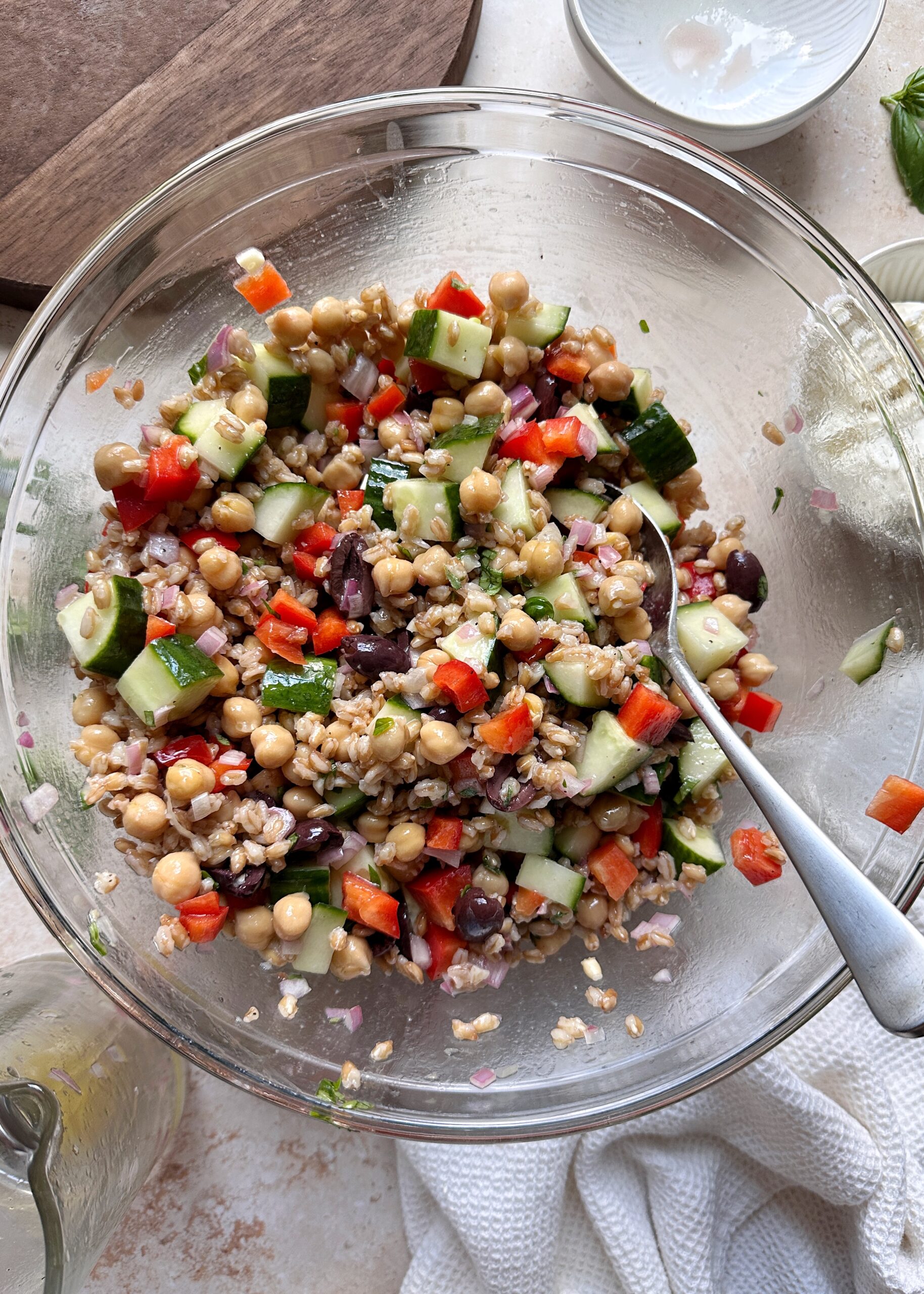 farro salad in a glass mixing bowl