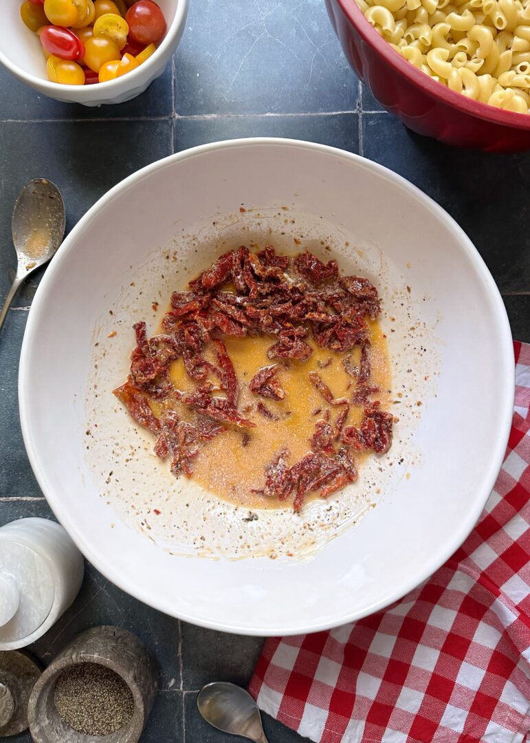 sundried tomato dressing for pasta salad in mixing bowl