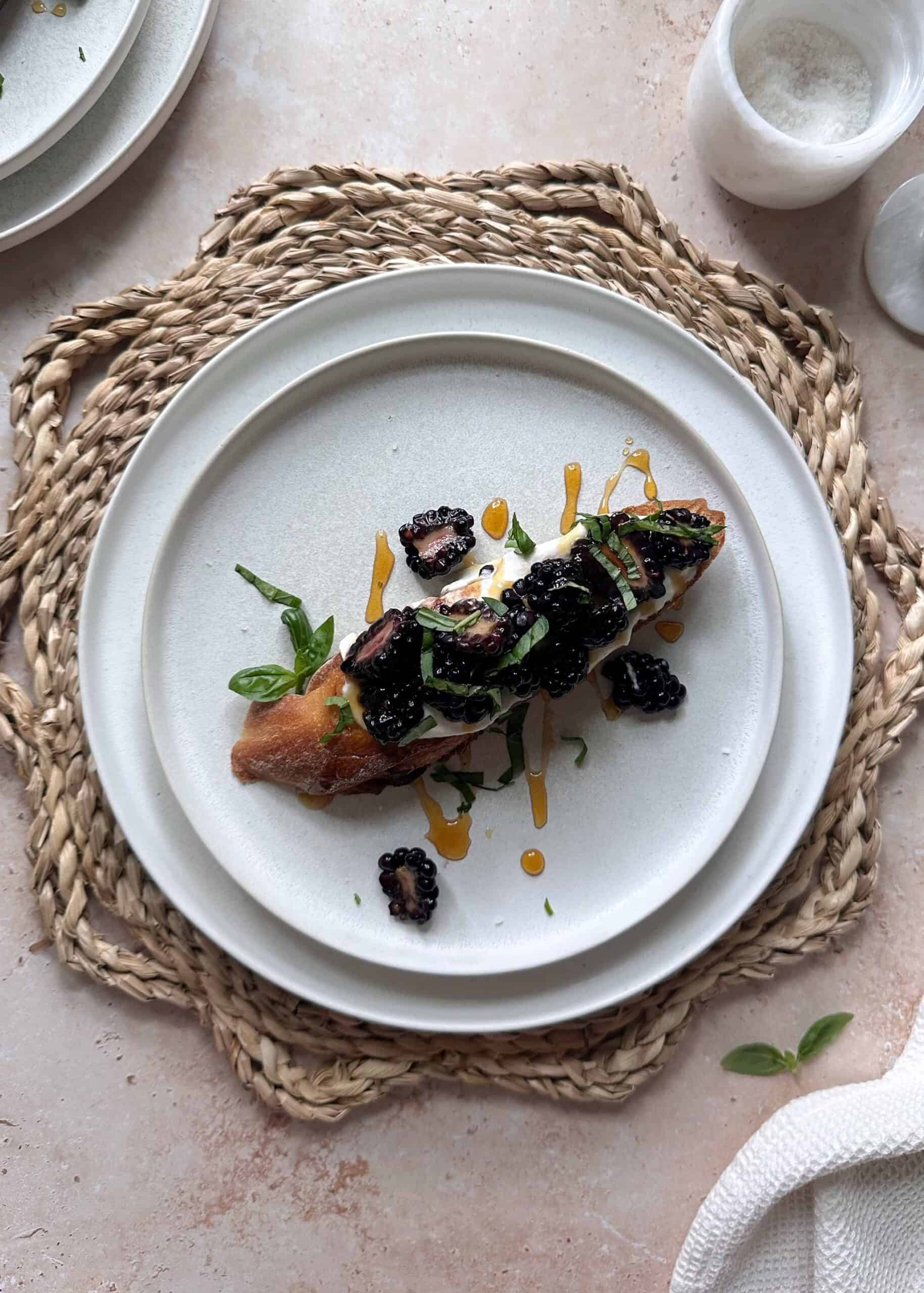 whipped ricotta and blackberry toast with honey and fresh basil
