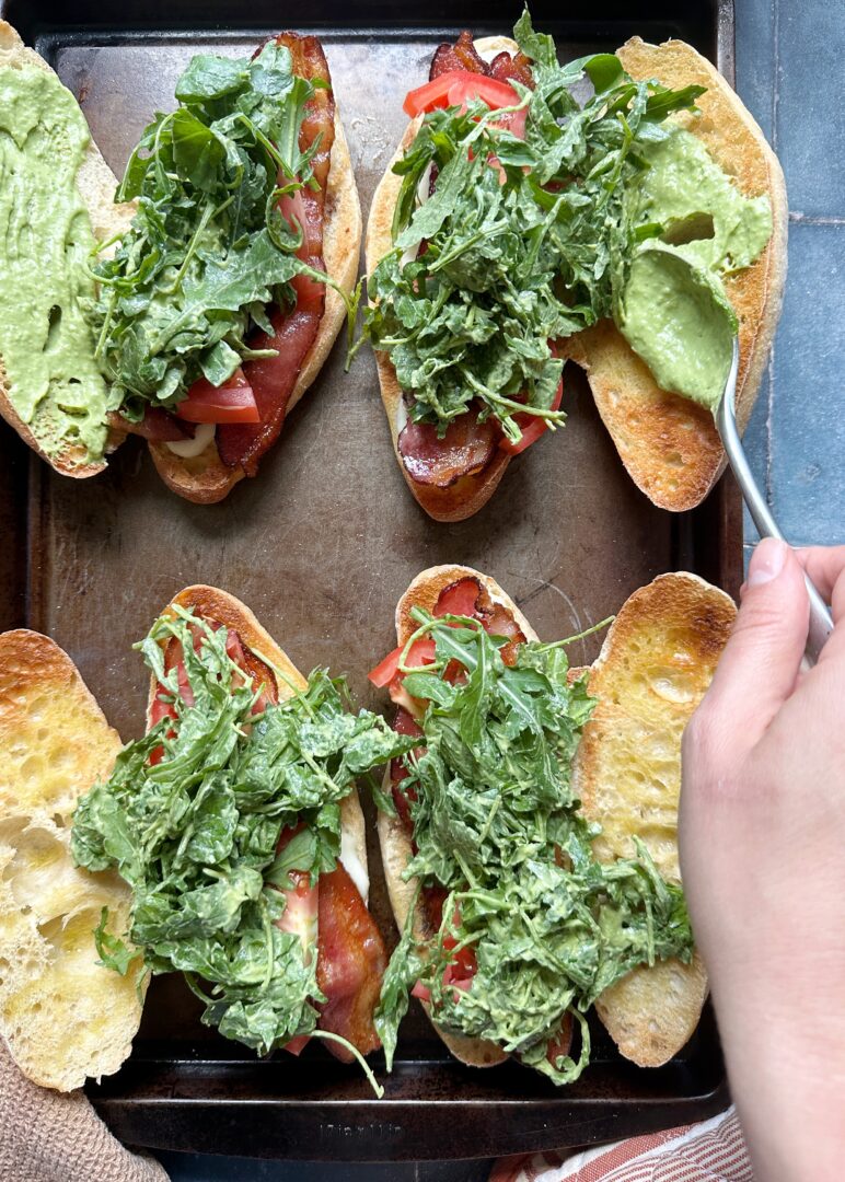 adding green goddess dressing to caprese melt sandwiches