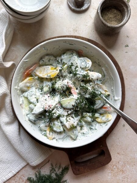 bowl of carrot and cucumber salad with greek yogurt dressing