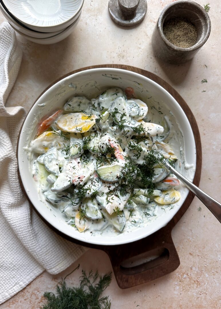 bowl of carrot and cucumber salad with greek yogurt dressing