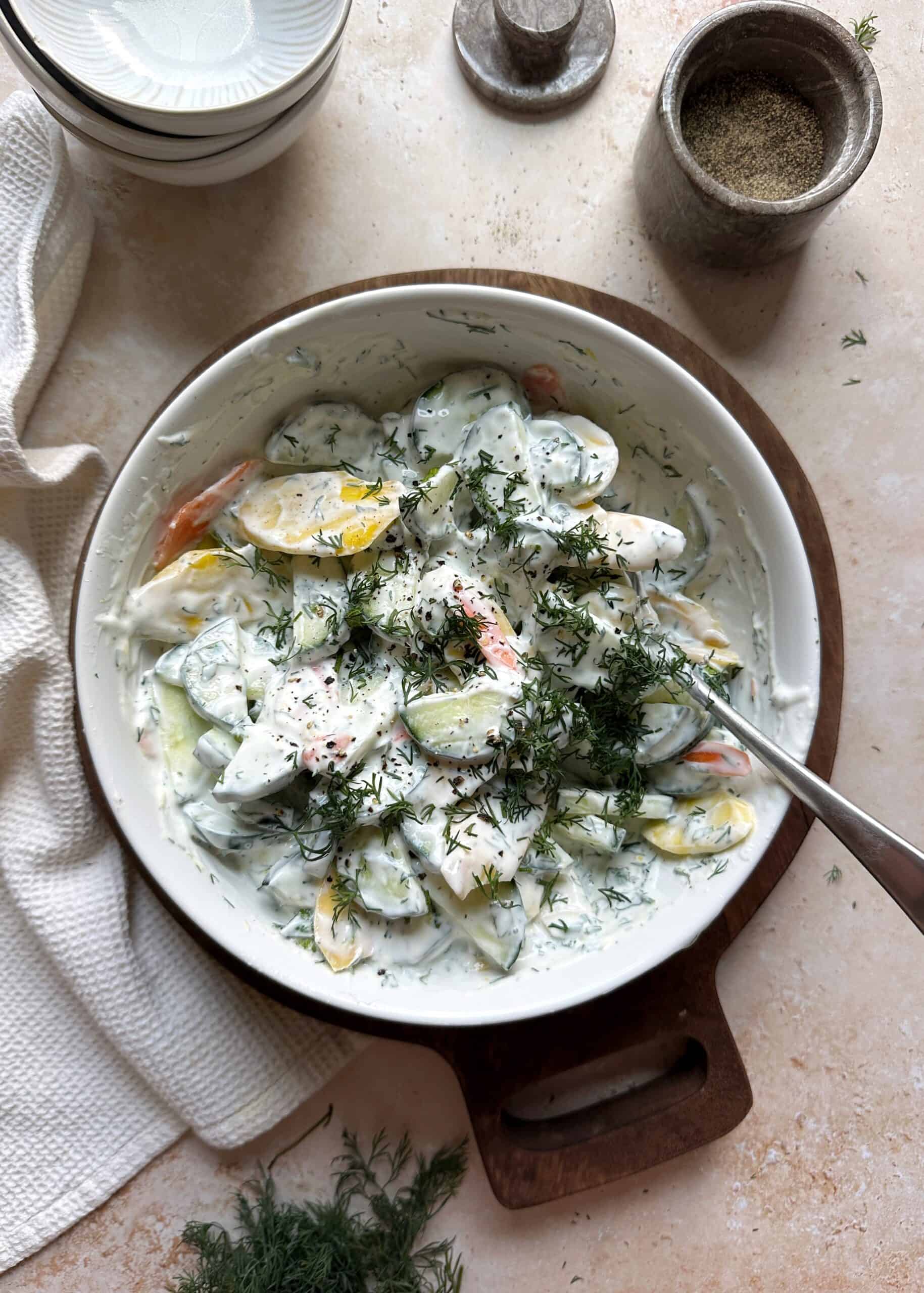 bowl of carrot and cucumber salad with greek yogurt dressing