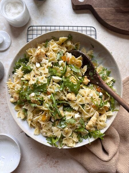 bowl of pasta salad with cauliflower olives and apricots