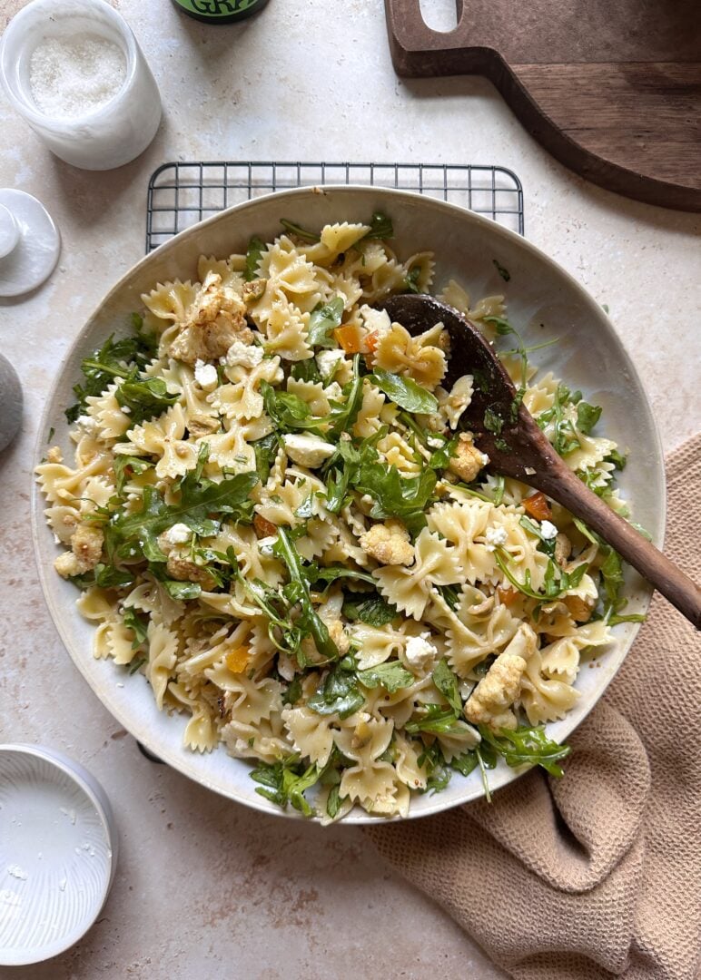 bowl of pasta salad with cauliflower olives and apricots