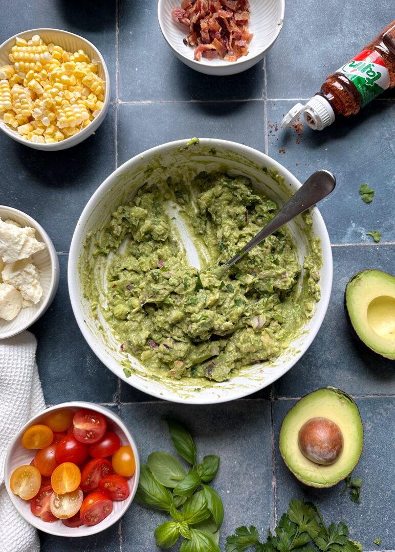 classic guacamole in white mixing bowl