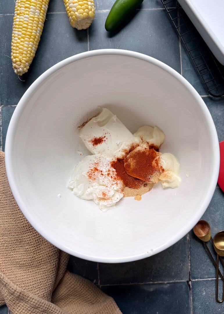 elote dip base ingredients in mixing bowl