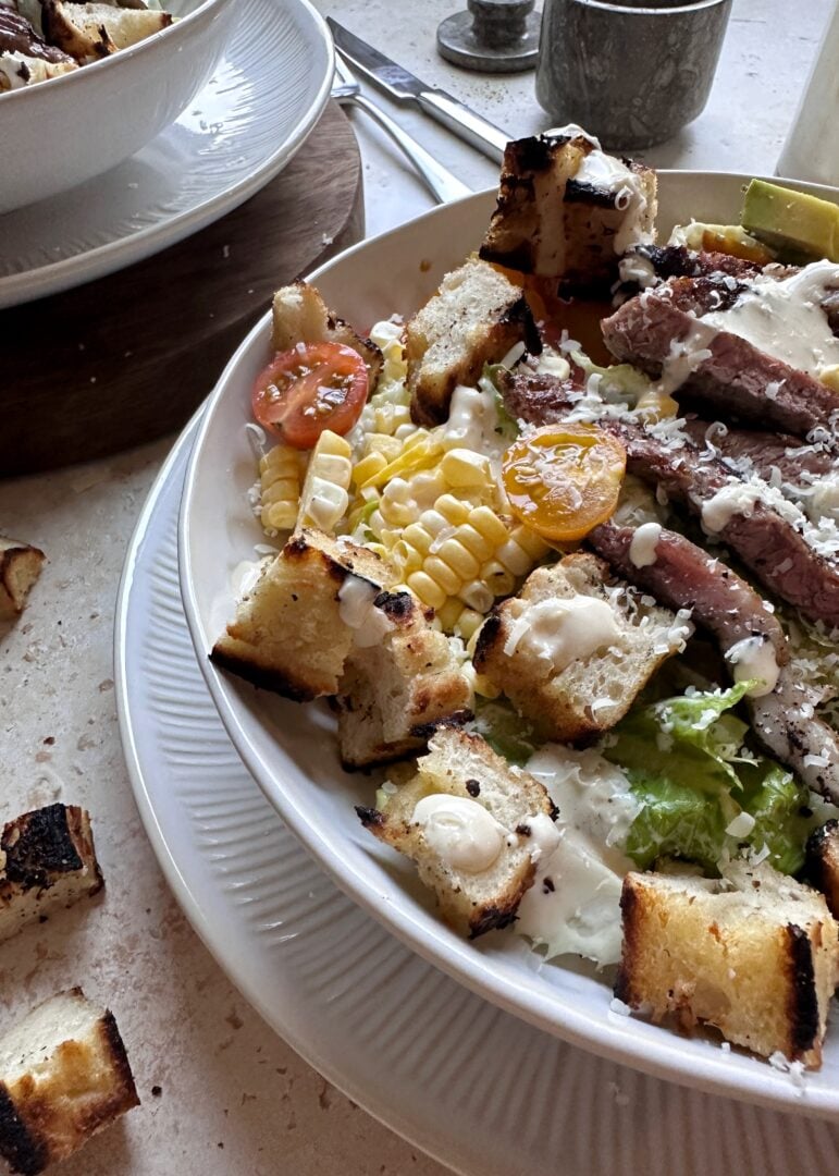 grilled steak caesar salad with focaccia croutons