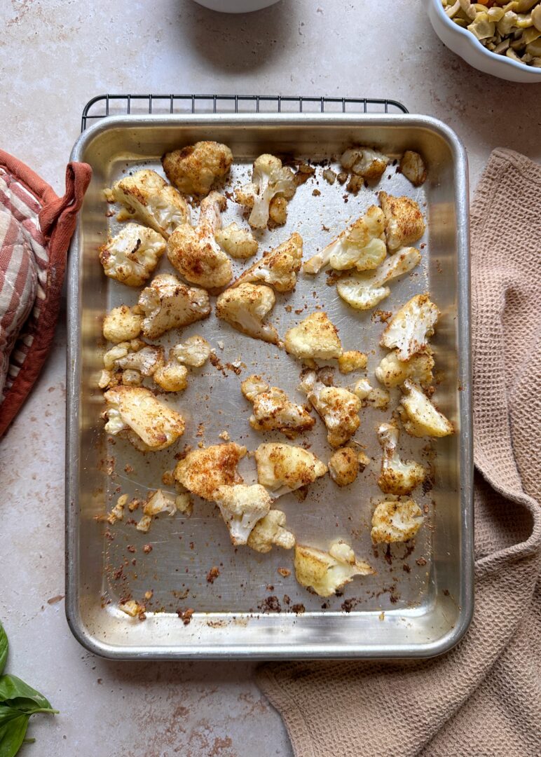 roasted cauliflower on a silver baking sheet