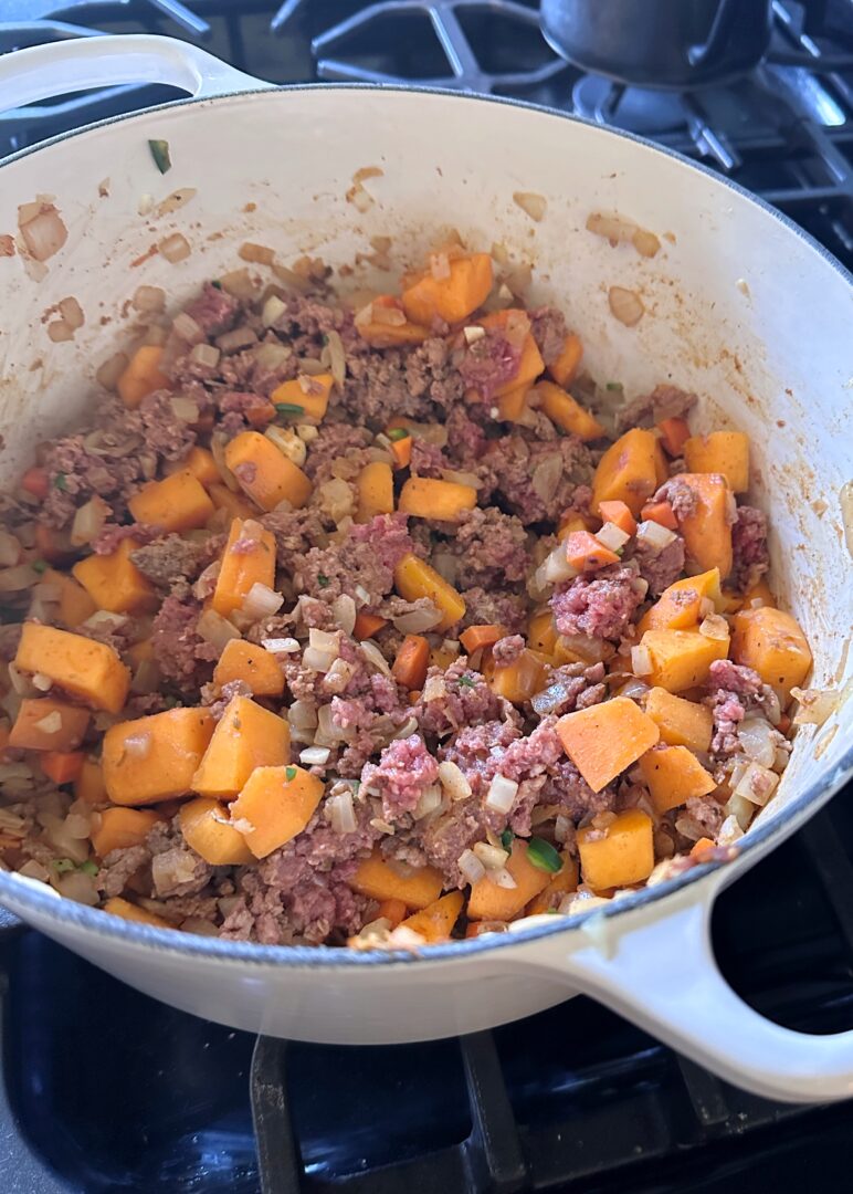 autumn squash and browned beef in dutch oven for chili