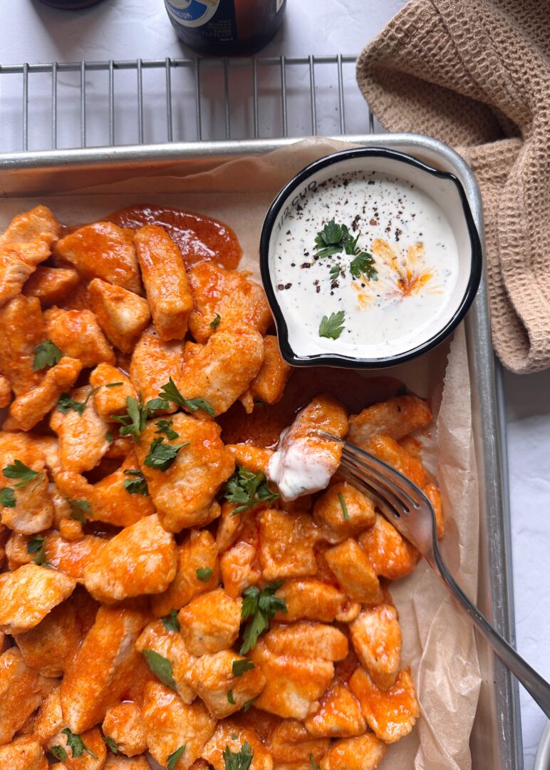 baked boneless chicken wings dipped in ranch dressing
