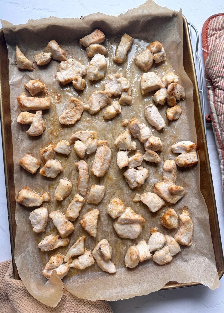 baked boneless chicken wings on a large baking sheet