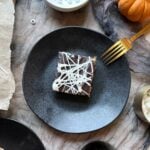 black plate with spiderweb smores bars